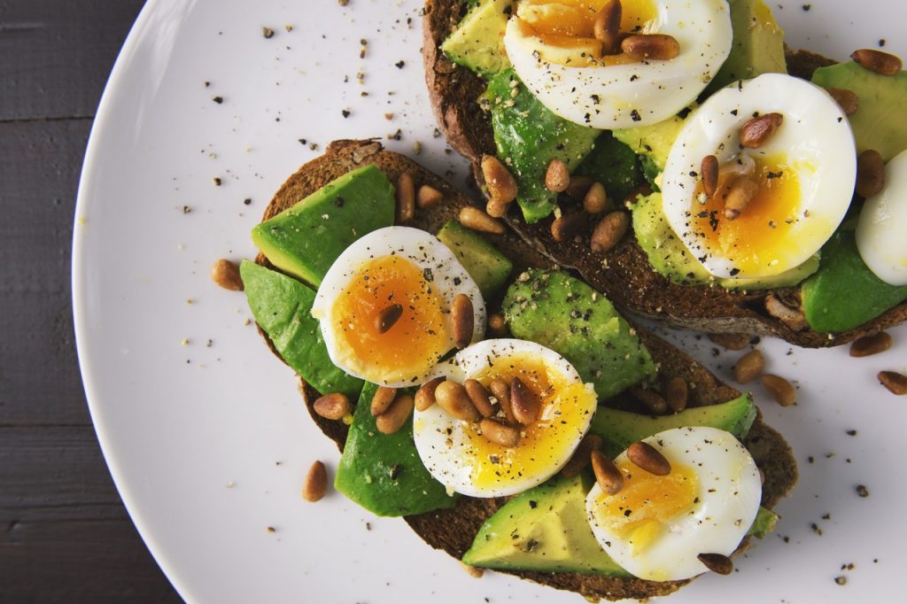 balanced dish with avocado, eggs and carbohydrates