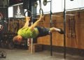 athlete trains strength and balance with the rings